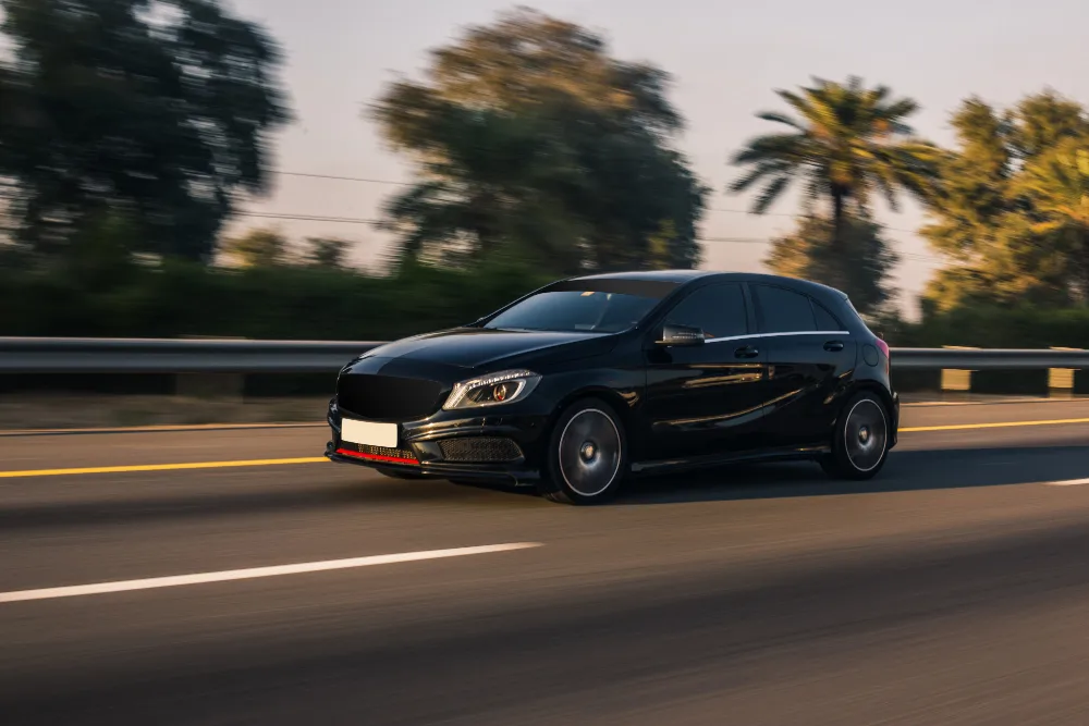 Premium hatchback driving on the highway
