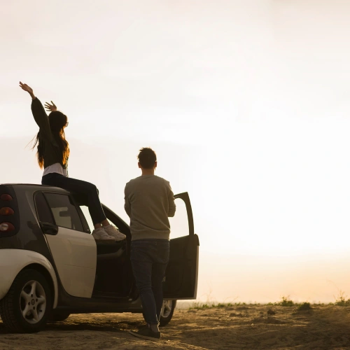 Travelers with a rental on a scenic road